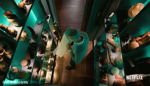 A Man In A Museum With A Netflix Logo On The Bottom Right GIF