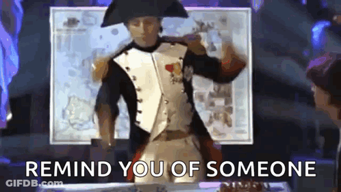 A Man In A Napoleon Costume Is Dancing With The Words Remind You Of Someone Behind Him GIF