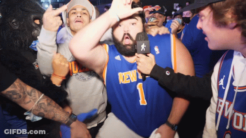 A Man In A New York Jersey Is Being Interviewed GIF