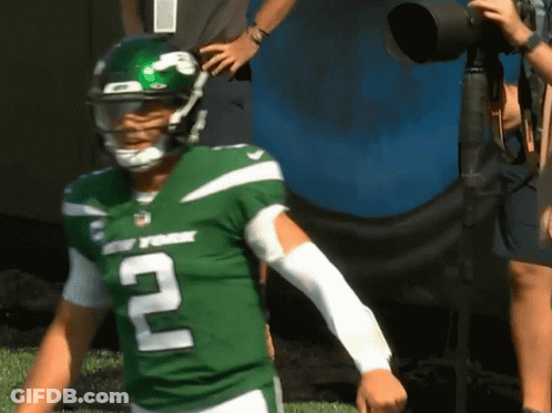 A Man In A New York Jets Uniform Stands On A Field GIF