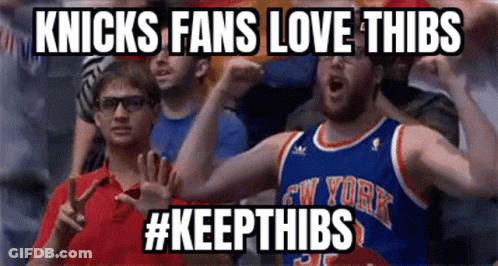 A Man In A New York Knicks Jersey Is Cheering GIF