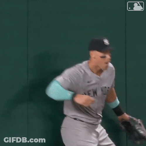 Man In Yankees Uniform Running GIF