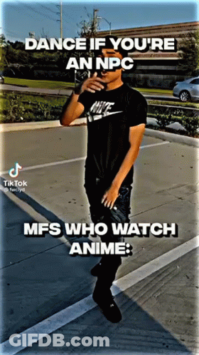 A Man In A Nike Shirt Is Standing In A Parking Lot . GIF