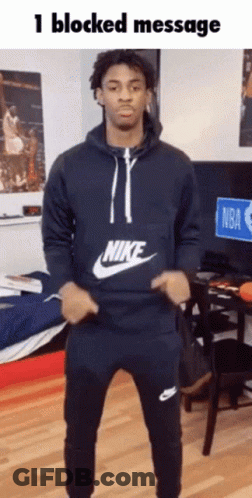 A Man In A Nike Sweatshirt Is Dancing GIF