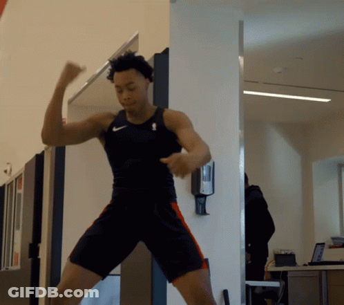 A Man In A Nike Tank Top And Shorts Is Dancing GIF