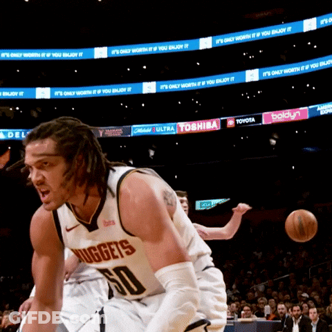 A Man In A Nuggets Jersey Dribbles A Ball GIF