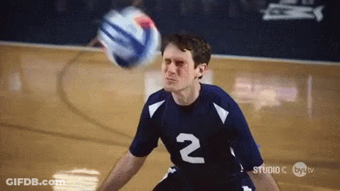 A Man In A Number 2 Jersey Is Playing Volleyball On A Court GIF