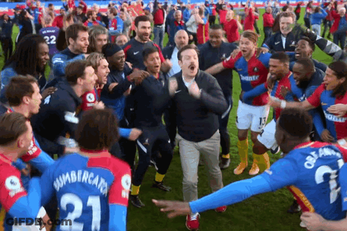 A Man In A Number 21 Jersey Is Surrounded By Other Soccer Players GIF