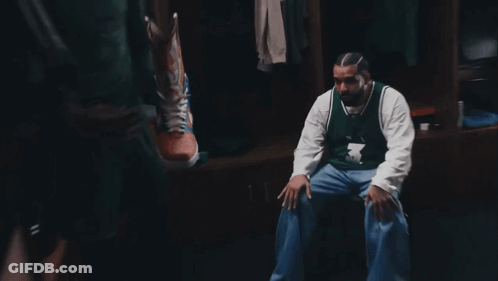 A Man In A Number 3 Jersey Sits In A Locker Room GIF