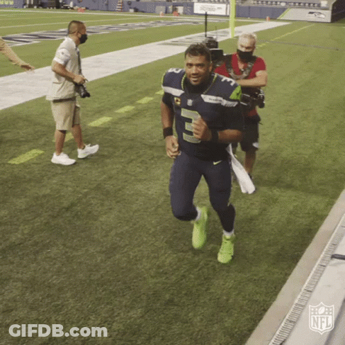 A Man In A Number 5 Jersey Is Running On A Field GIF