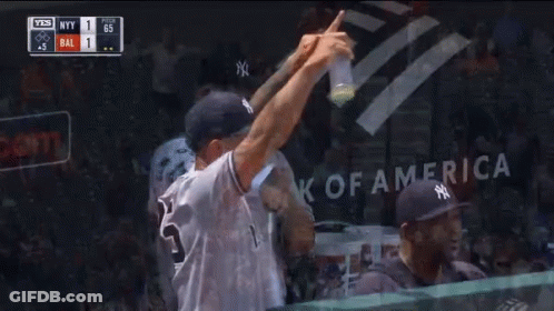 A Man In A Ny Yankees Hat Holds A Sign GIF