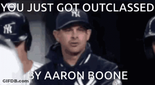 A Man In A Ny Yankees Hat Is Talking To His Teammates GIF