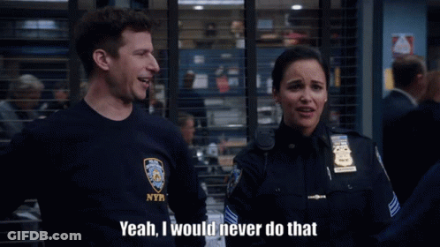 A Man In A Nypd Shirt Is Talking To A Woman GIF
