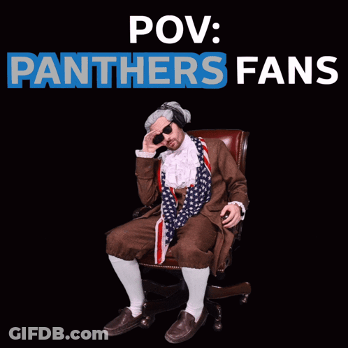 A Man In A Panthers Costume Sits In A Chair GIF
