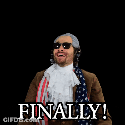 A Man In A Patriotic Costume Has His Arms In The Air And The Word Finally Is Behind Him GIF