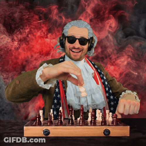 A Man In A Patriotic Costume Playing Chess GIF