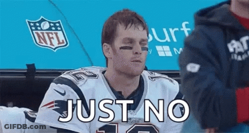 A Man In A Patriots Jersey Is Sitting In A Dugout With The Words Just No Written On His Face . GIF