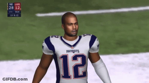 A Man In A Patriots Jersey Is Standing On A Field GIF
