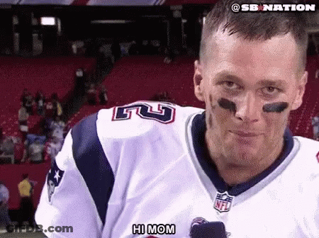 A Man In A Patriots Jersey Says Hi Mom In Front Of A Crowd GIF