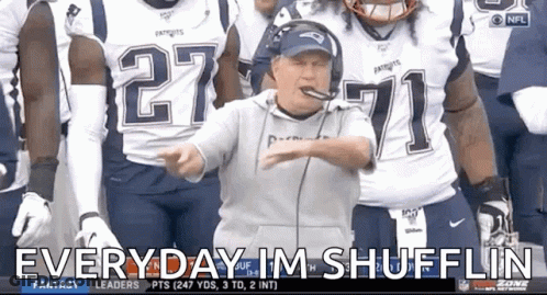 A Man In A Patriots Jersey Stands In Front Of A Group Of Football Players GIF