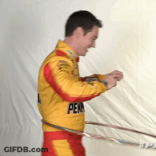A Man In A Pennsylvania Racing Suit Hula Hoops GIF