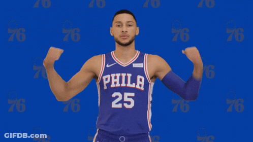A Man In A Philadelphia 25 Jersey Flexes His Muscles GIF