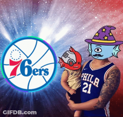A Man In A Philadelphia Jersey Is Holding A Baby GIF