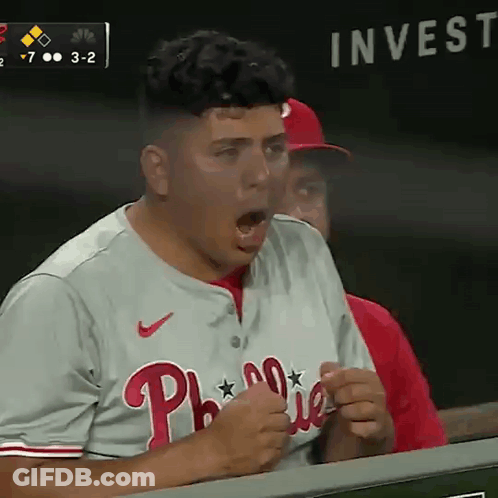 A Man In A Phillies Jersey Is Screaming GIF