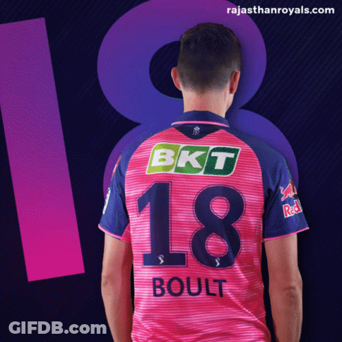 A Man In A Pink And Blue Jersey With The Number 18 On It GIF