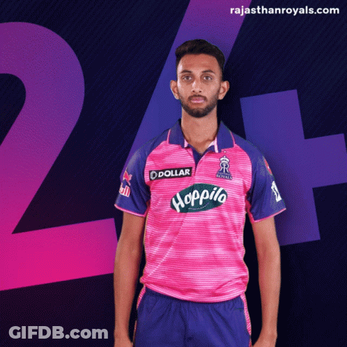 A Man In A Pink And Blue Jersey With The Word Hoppito On The Front GIF