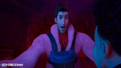 A Man In A Pink Coat Is Talking To Another Man In A Dark Room With #Spiderverse Written In The Corner GIF