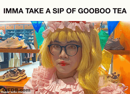A Man In A Pink Dress With A Yellow Wig And Glasses Says Imma Take A Sip Of Gooboo Tea GIF