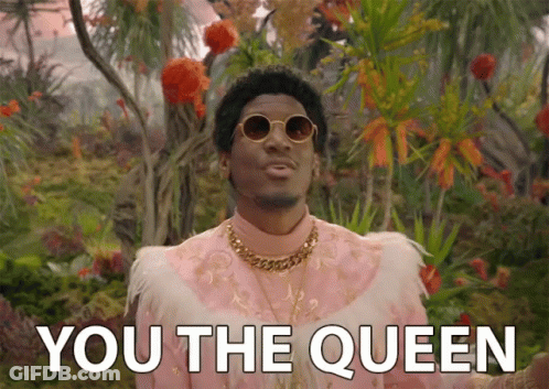 A Man In A Pink Feathered Outfit Says " You The Queen " GIF