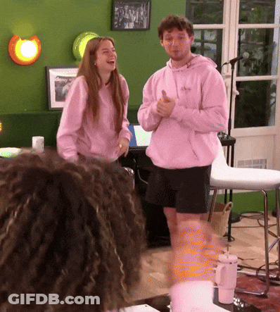 Man In Pink Hoodie Thumbs Up With Woman GIF
