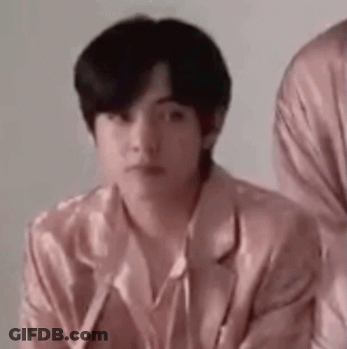 A Man In A Pink Jacket Is Sitting Next To Another Man In A Pink Jacket . GIF