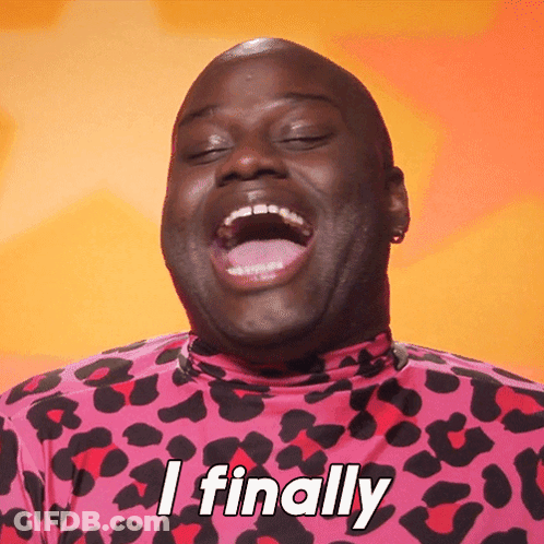 A Man In A Pink Leopard Print Shirt Is Laughing And Saying " I Finally " GIF