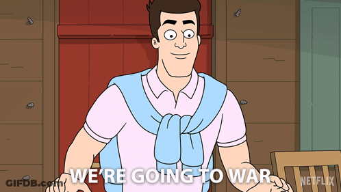 A Man In A Pink Shirt And Blue Sweater Says " We 'Re Going To War " GIF