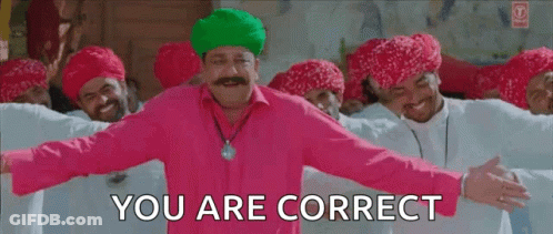 A Man In A Pink Shirt And Green Turban Is Standing In Front Of A Group Of Men And Says `` You Are Correct '' . GIF