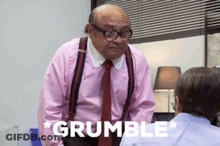 A Man In A Pink Shirt And Tie Is Standing Next To Another Man In A Blue Shirt . GIF