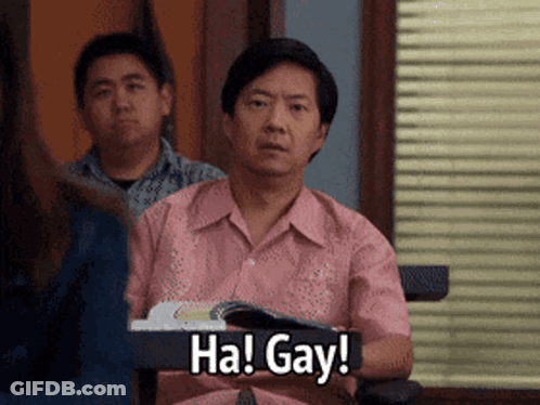 A Man In A Pink Shirt Is Holding A Book And Saying Ha Gay GIF