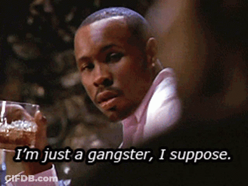 A Man In A Pink Shirt Is Holding A Glass Of Beer And Says I 'M Just A Gangster I Suppose GIF
