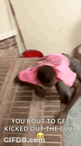 A Man In A Pink Shirt Is Laying On The Floor With A Caption That Says `` You Bout To Get Kicked Out The Club '' GIF