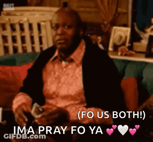 A Man In A Pink Shirt Is Sitting On A Couch Holding A Glass Of Wine And Says Ima Pray Fo Ya . GIF