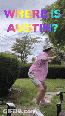 Pink Shirt Man Standing In Front Of Where Is Austin Sign GIF