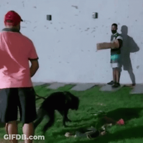 A Man In A Pink Shirt Is Standing Next To A Man In A Black Shirt GIF