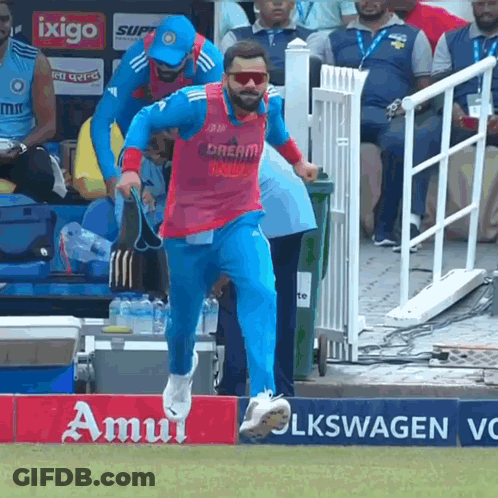 A Man In A Pink Shirt That Says Dream India GIF