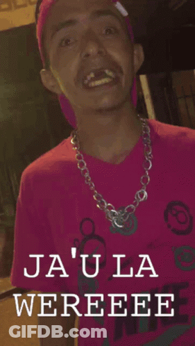 A Man In A Pink Shirt With The Words Ja ' Ula Wereee On The Bottom GIF