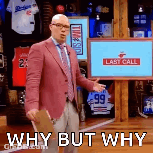 A Man In A Pink Suit And Tie Is Standing In Front Of A Screen That Says Last Call GIF