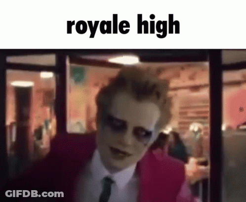 A Man In A Pink Suit And Tie Is Standing In Front Of A Window With The Words `` Royale High '' Written On It . GIF