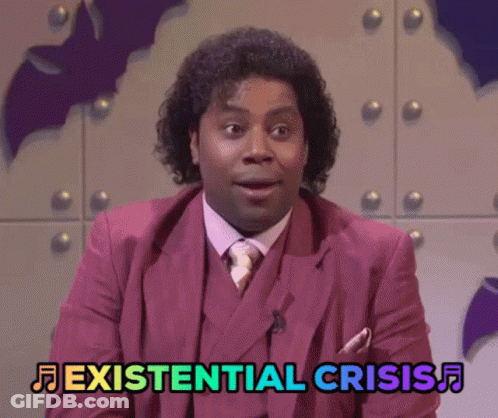 A Man In A Pink Suit And Tie Says Existential Crisis GIF
